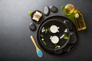 Spa Wellness Relax concept. Spa background with spa accessories on dark background. View from above with copy space.