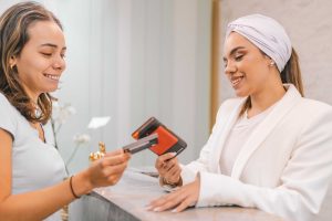 Woman paying at a medspa for points