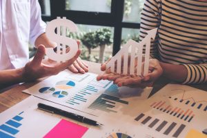 Two businessmen at work, Business crew working with new startup financial project plan,man and woman discussion issues to achieve better results, business strategy, growth development Selective Focus.